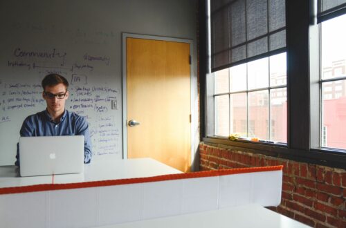 Man Working On Laptop In Loft Office Free Stock Picture