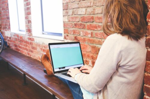 Woman Working On Laptop On Bench Free Stock Picture