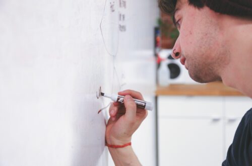 Man Writing On Whiteboard Free Stock Picture