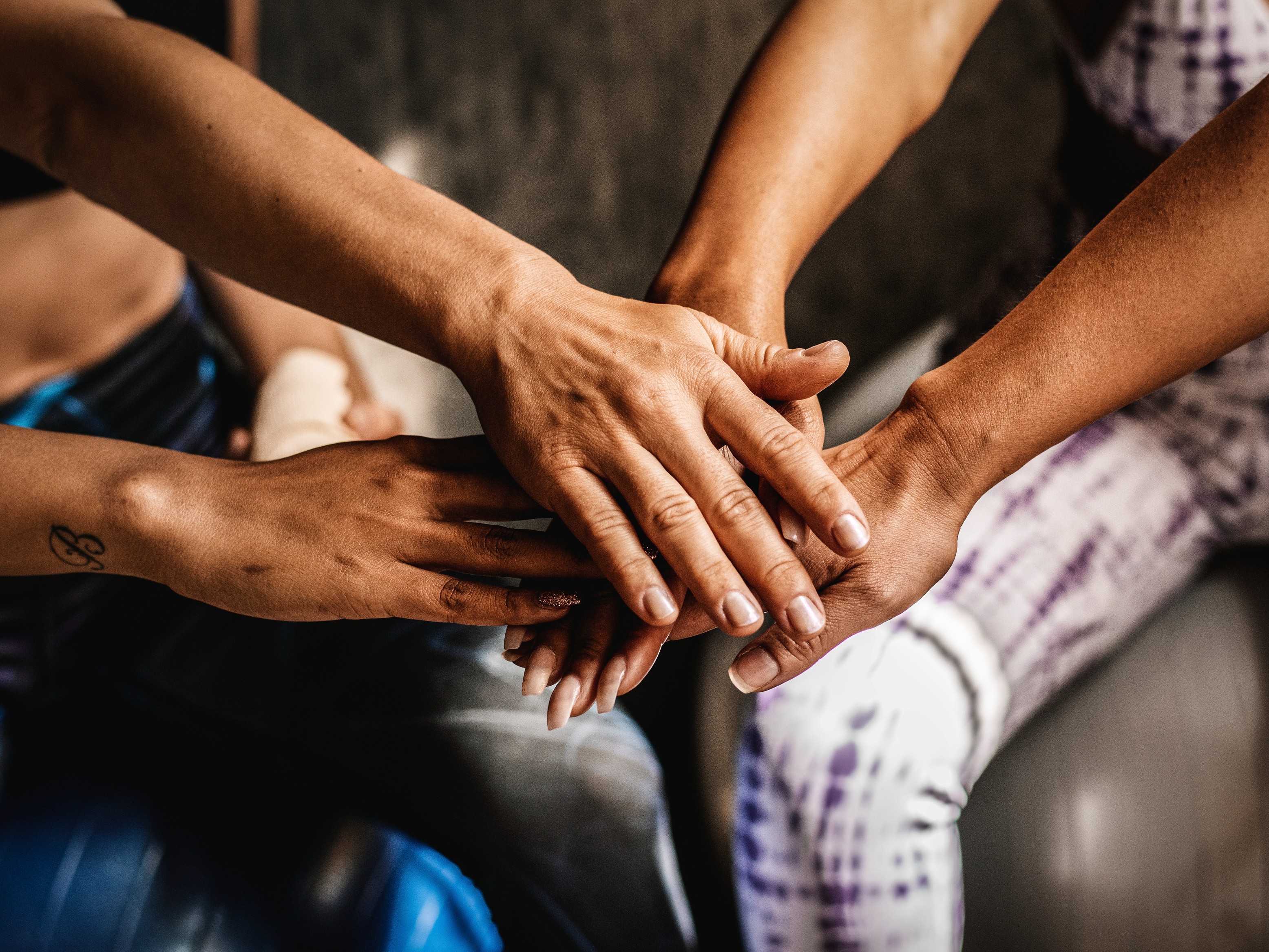 Hands centered together indicating teamwork and unity