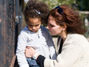 Upset mom talking to worried daughter