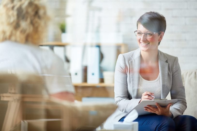 Image of a woman taking notes.