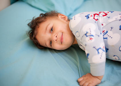 Toddler boy in snowman pyjamas