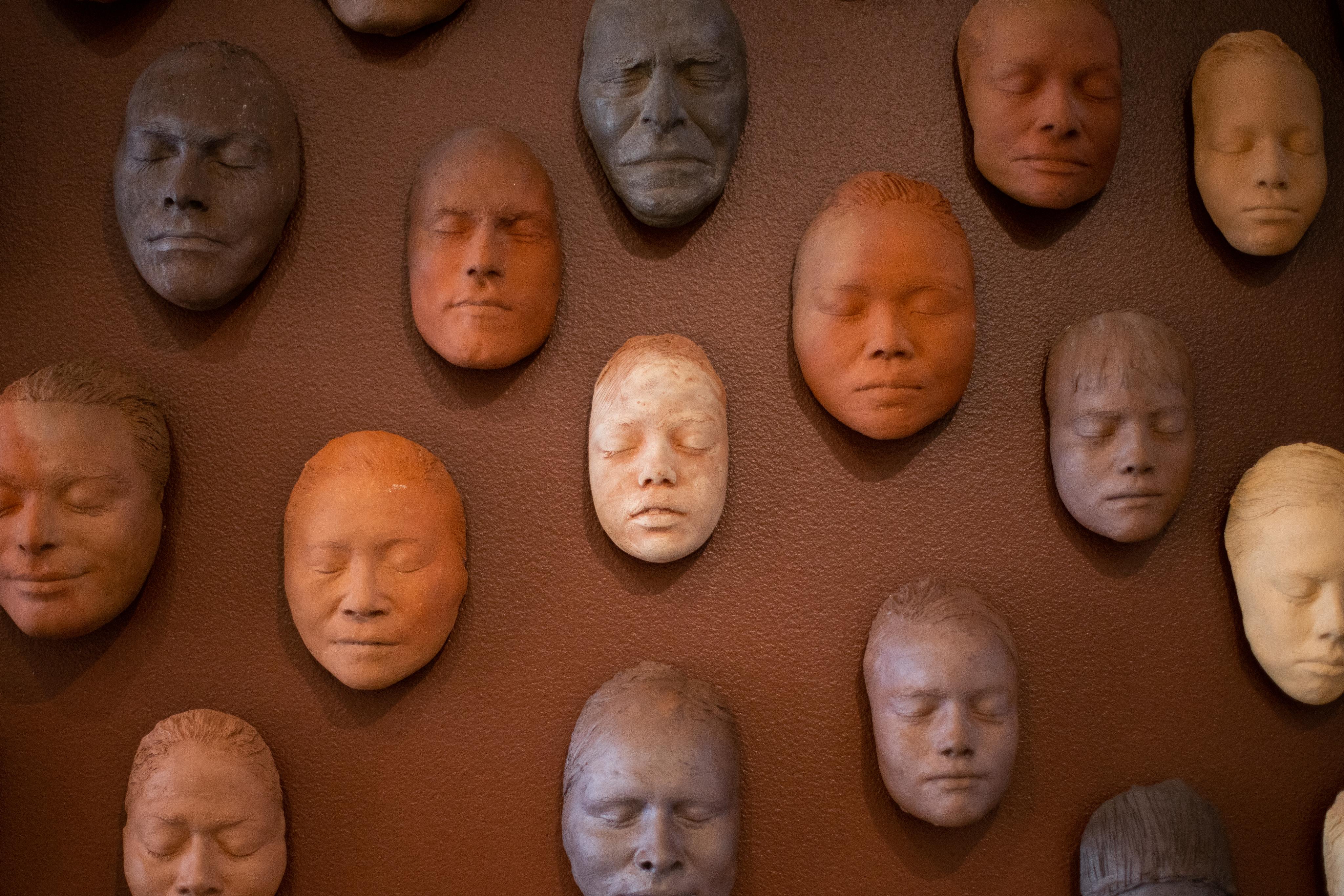 A close-up view of the clay masks featured in the Faces of Ruth Asawa exhibit.