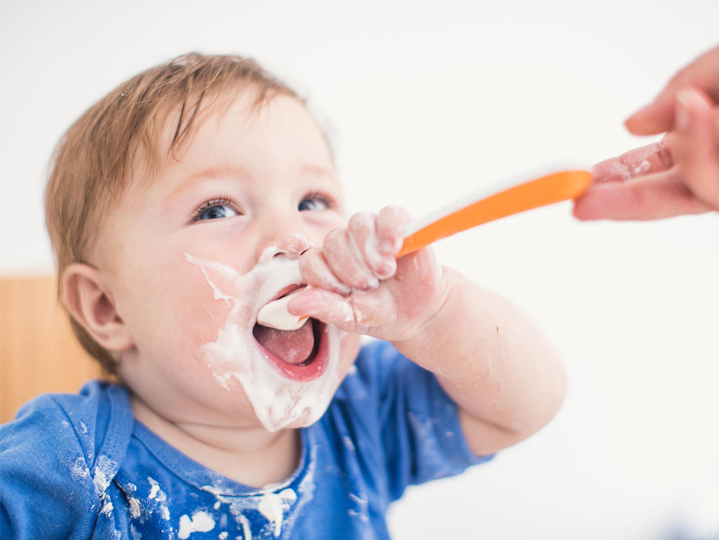 baby eating yogurt 