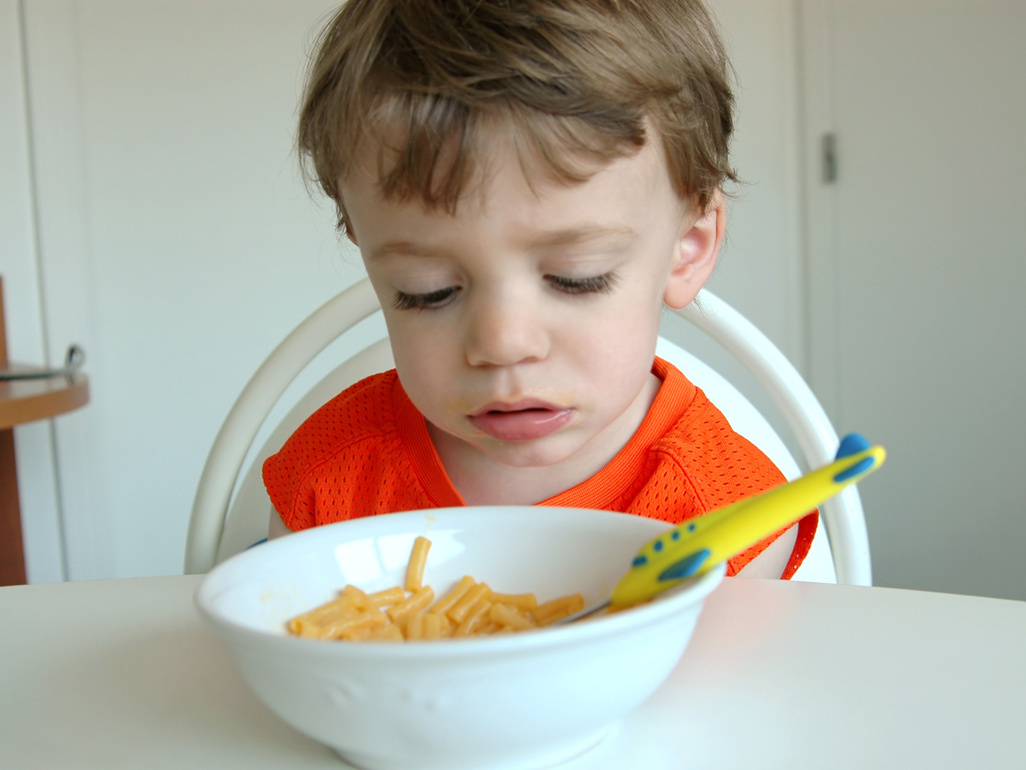 boy looking at his food bowl