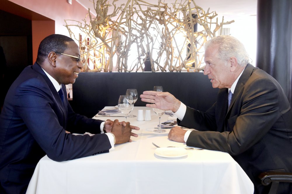 Two people talking over lunch