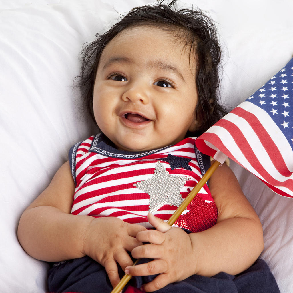 baby holding an American flag