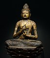 A gilt-wood statue of Vairocana Buddha, Heian period, 11th-12th century.