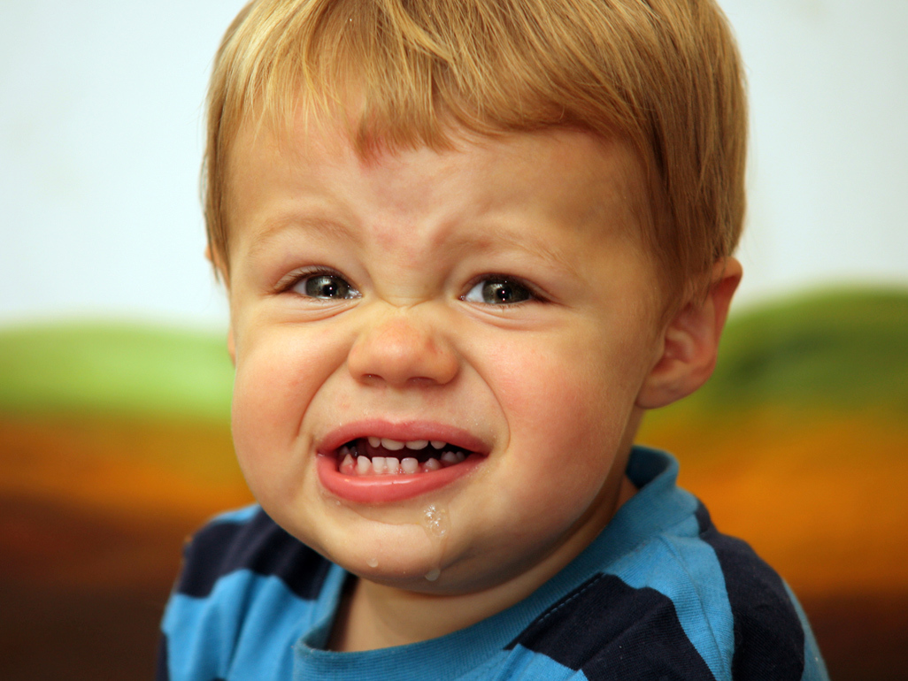 boy crying and driveling with mouth open