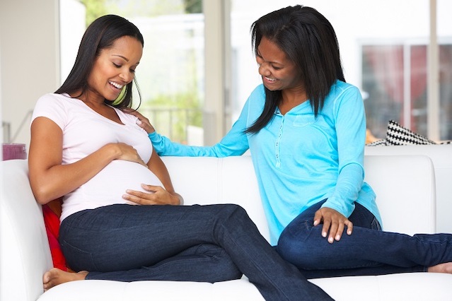 Woman Visiting Pregnant Friend At Home