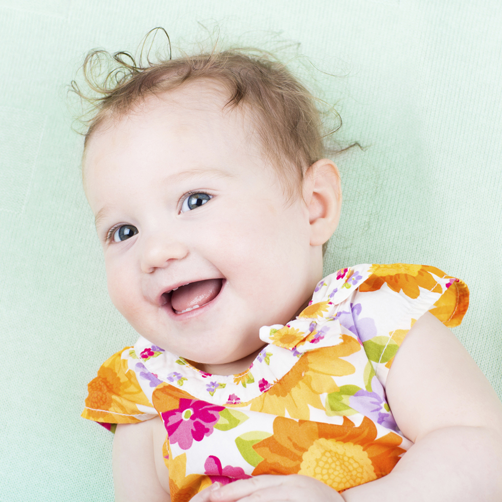 baby in flowered dress