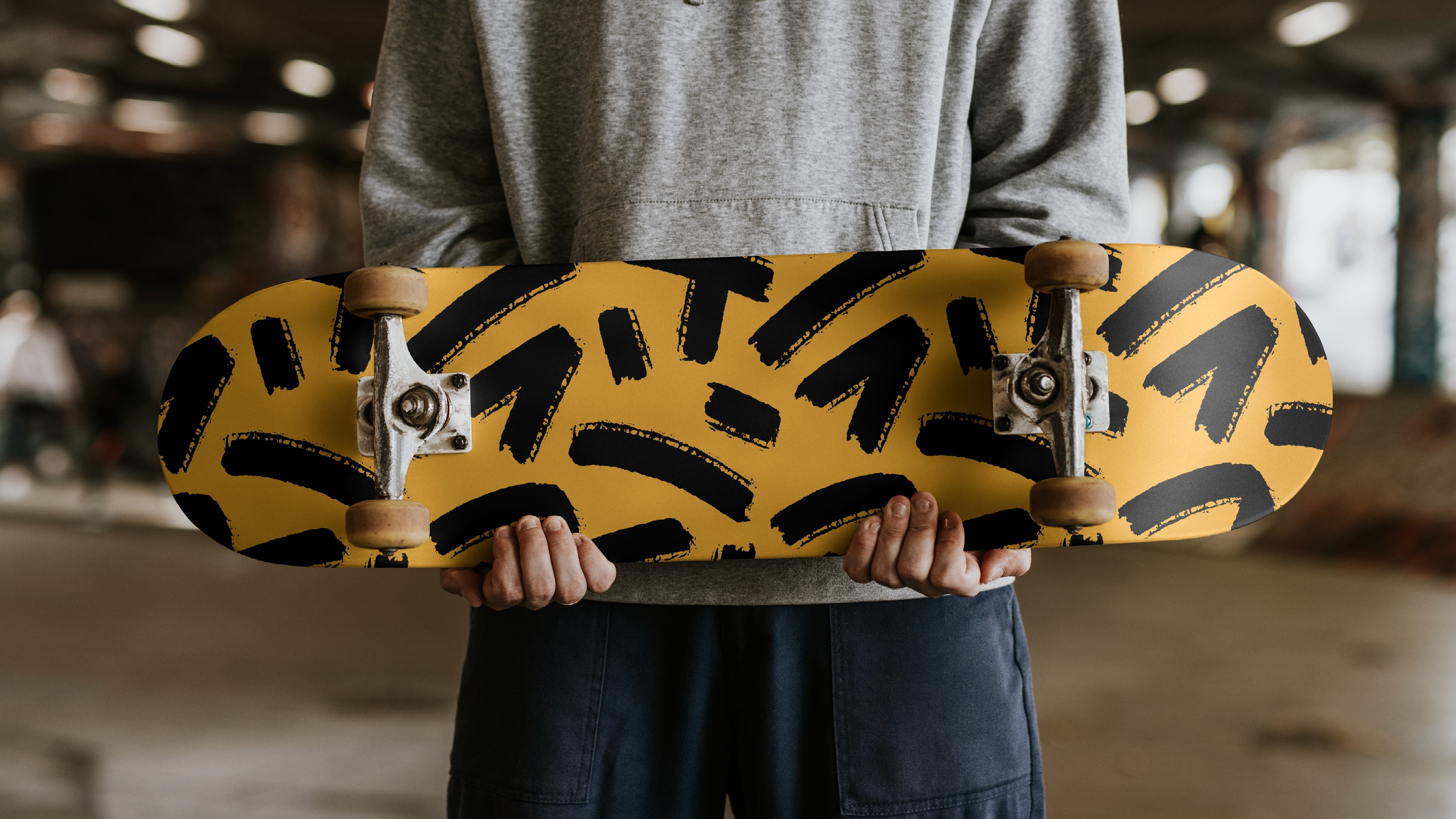 young man with an abstract design skateboard