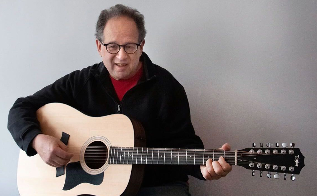 Bud Kraus playing the guitar