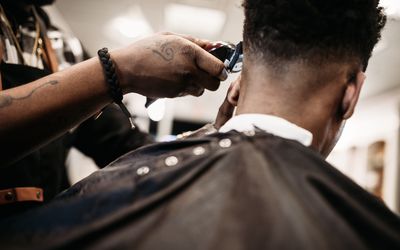 Black man getting his hair cut at the barber
