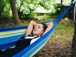 Beautiful woman enjoying in hammock 