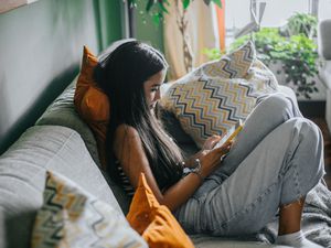 teenager playing on their phone