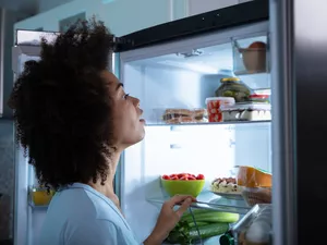 Woman Searching Food In Refrigerator