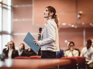 Business People Listening to the Speaker at a Conference