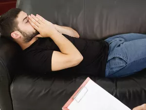 young man talking to a therapist