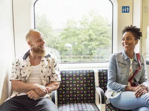 Couple flirting on train