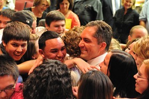 Teacher Being Hugged by Kids