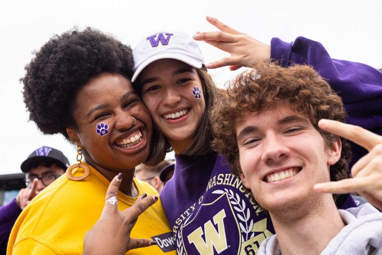 Students and fans cheer at the UW football game vs USC.