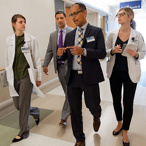 Mayo Clinic residents and faculty member on hospital rounds