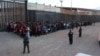 U.S. Border Patrol agents keep watch on a large group of migrants who they say were attempting to cross the U.S.-Mexico border illegally, in El Paso, Texas, May 29, 2019.