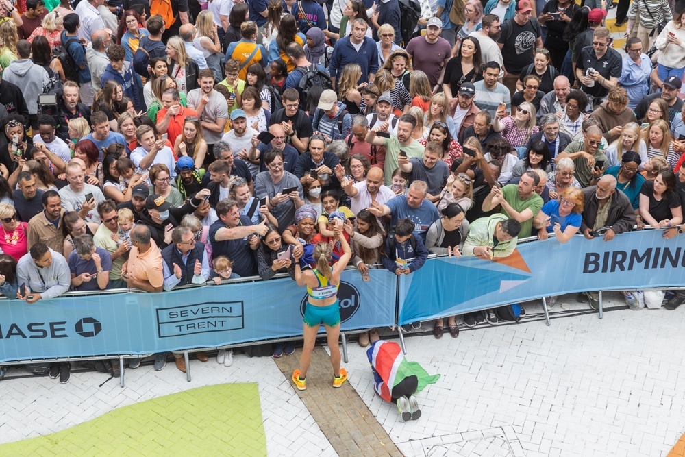 Marathon runners in the huge crowd at the finish line in Victoria Square. 