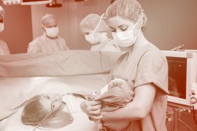 nurse with baby after mother's c-section