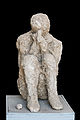 Cast sitting victim Pompeii.jpg