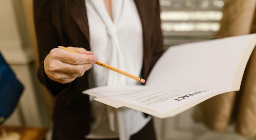 Closeup shot of a person holding a contract