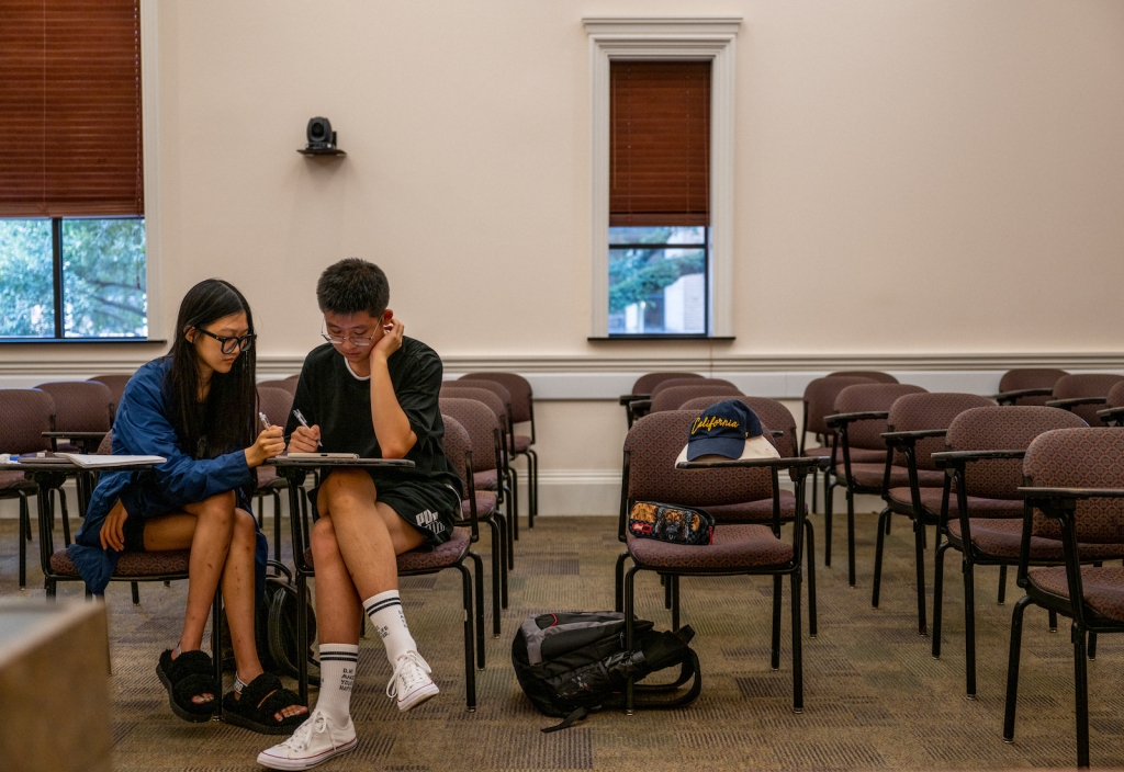 Two students studying at a table