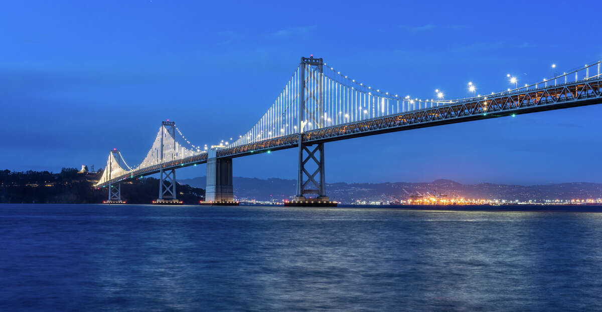 This twilight view from the Embarcadero in San Francisco features the "Bay Lights" installation on the Bay Bridge.