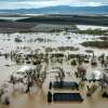 Floodwaters cover a property along River Rd. in Monterey County, Calif., as the Salinas River overflows its banks on Friday, Jan. 13, 2023.