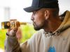 MELBOURNE, JANUARY 13, 2023: Nick Kyrgios cracks a beer after playing table tennis against Jordan Thompson at The Rooftop At QT, Melbourne. Picture: Mark Stewart