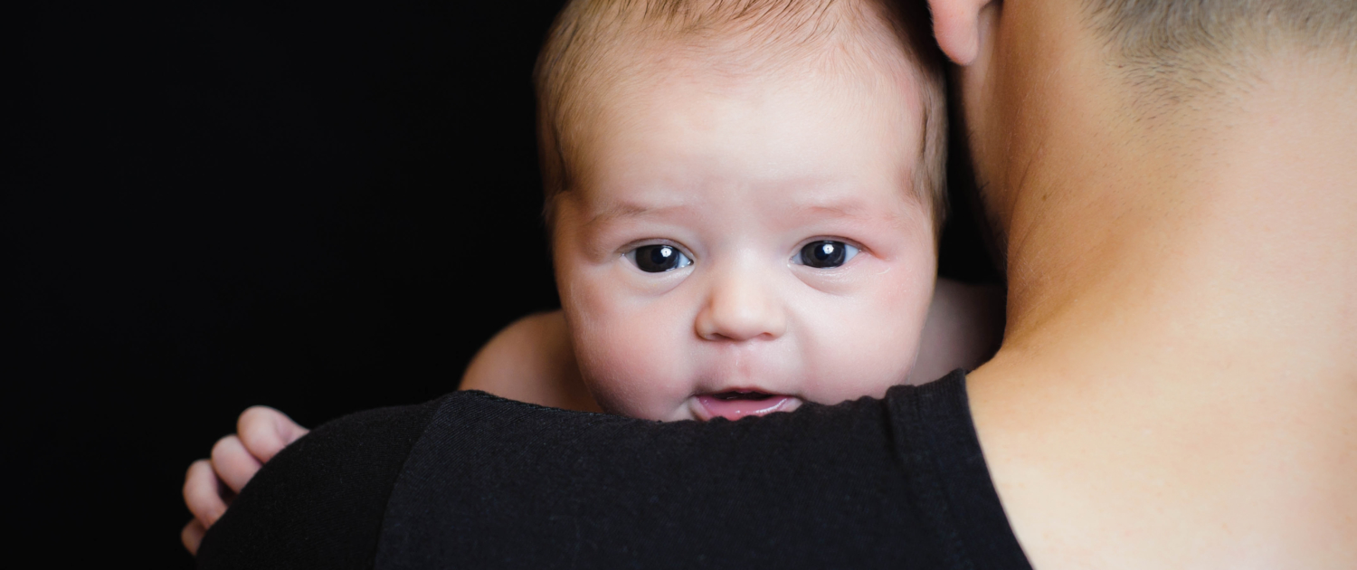 Father holding newborn baby