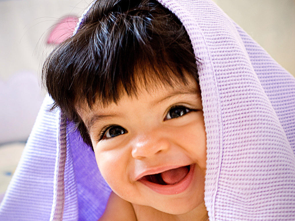 baby with towel on head