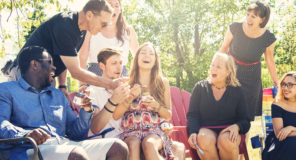 friends outside playing a baby shower game