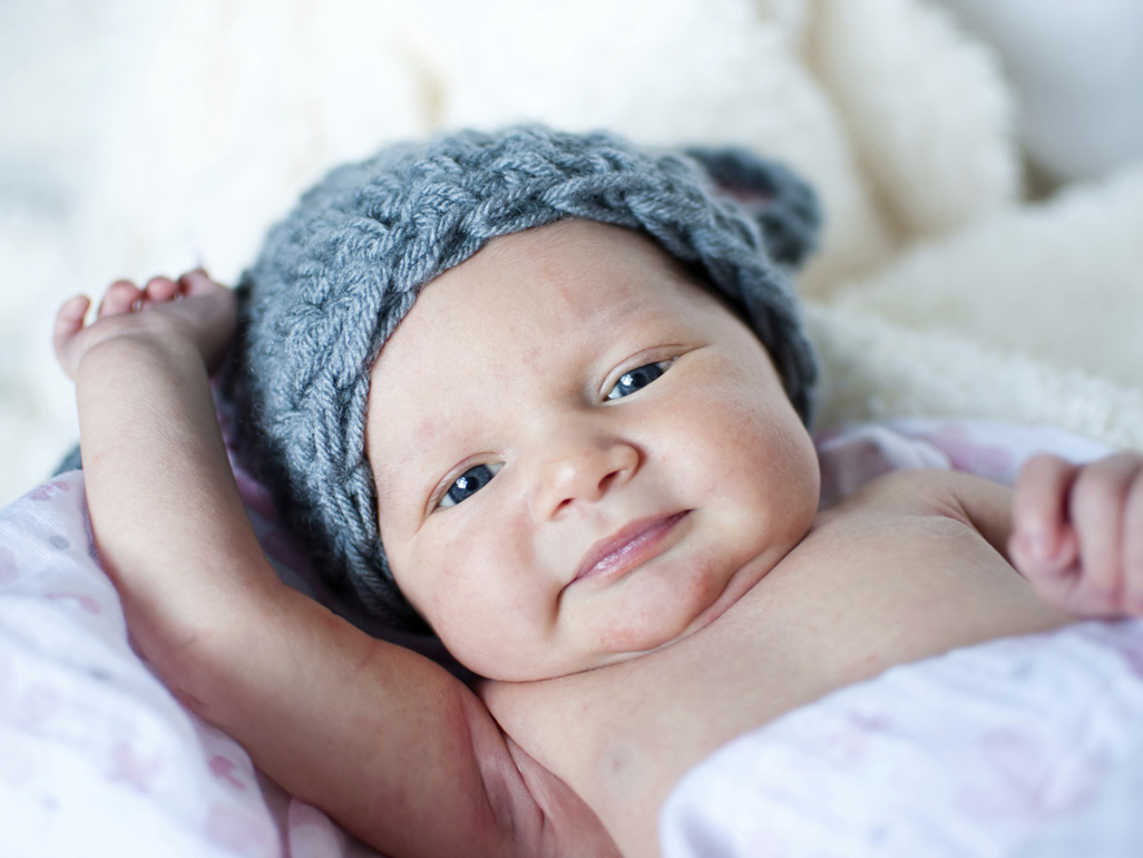 newborn baby in knit hat