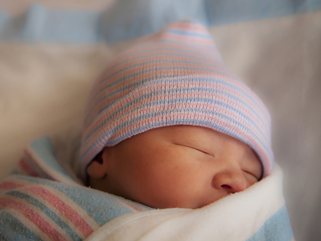 baby girl sleeping in woolen hat