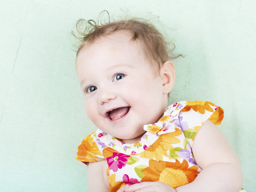 baby in flowered dress