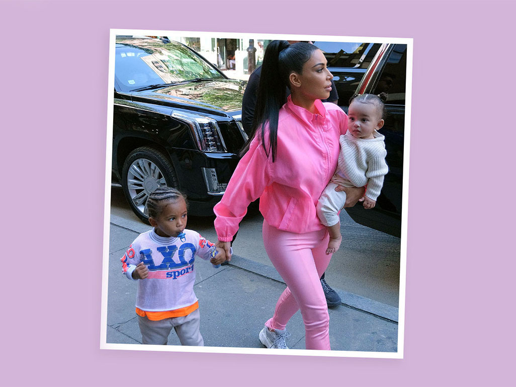 kim kardashian west walking with two of her children