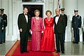 President Ronald Reagan and First Lady Nancy Reagan with Prime Minister Margaret Thatcher and Denis Thatcher at the beginning of an official dinner at the White House, 1988.