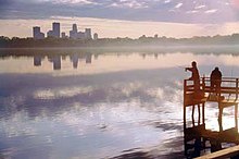 Downtown skyline in the view over Bde Maka Ska and its dock