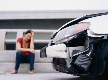 photo of person sitting on street curb