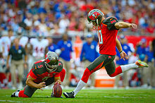 A placekicker attempts a field goal by kicking the ball from the hands of a holder.