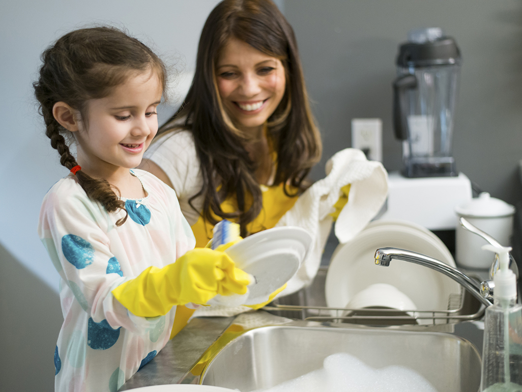 Mother and daughter doing the dishes