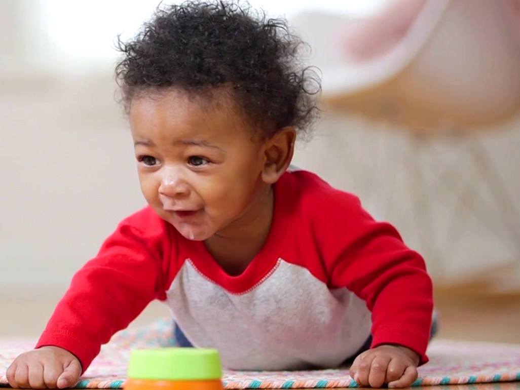 Baby having tummy time on a mat